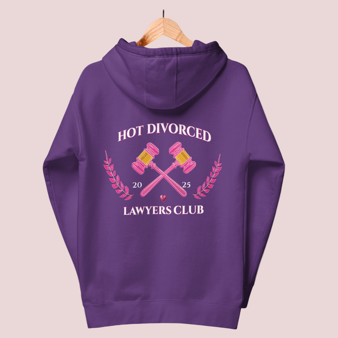 A purple, long-sleeved hoodie featuring the words "HOT DIVORCED LAWYERS CLUB 2025" with crossed pink gavels, pink laurel leaves, and a broken heart  graphic.
