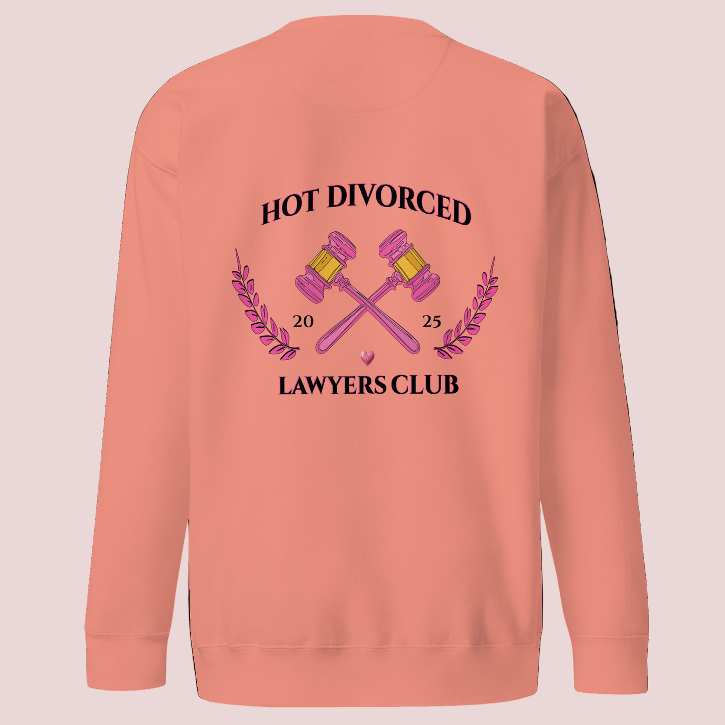 A dusty rose, long-sleeved sweatshirt featuring the words "HOT DIVORCED LAWYERS CLUB 2025" with pink crossed gavels, pink laurel leaves, and a broken heart graphics.