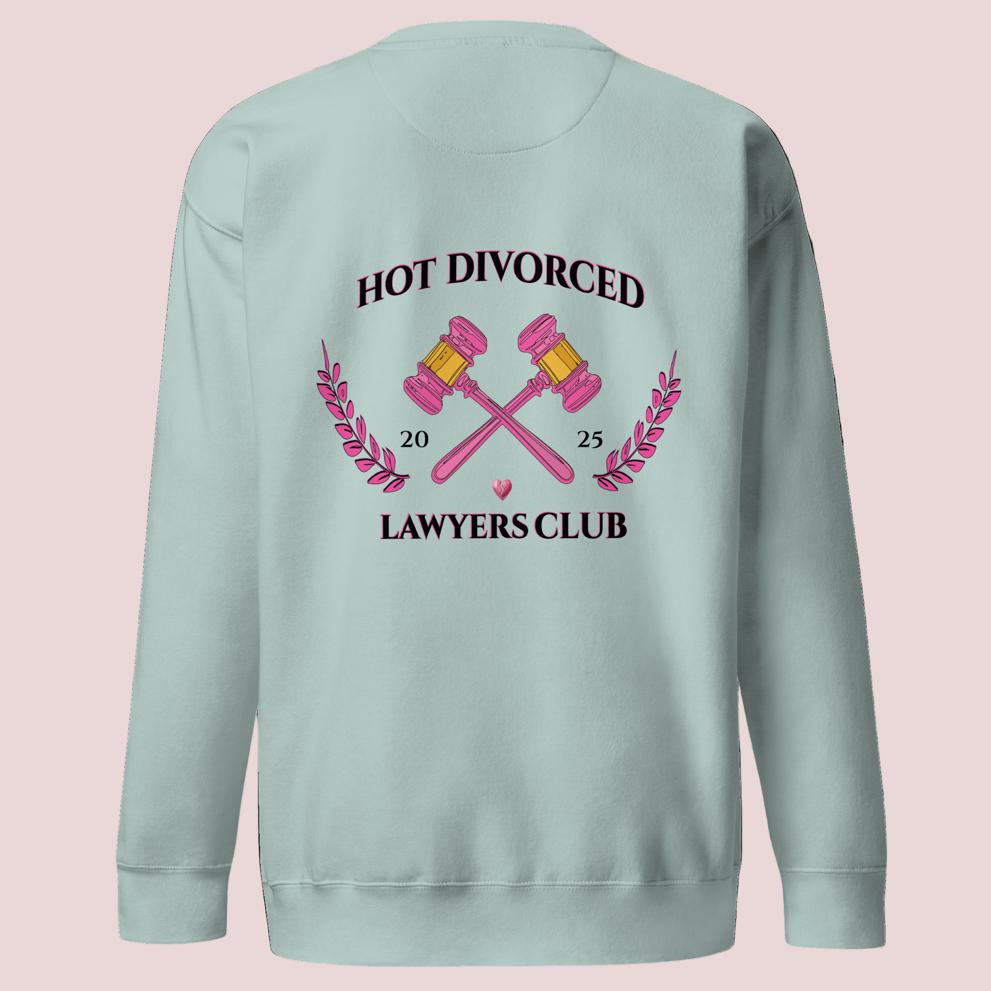 A powder blue, long-sleeved sweatshirt featuring the words "HOT DIVORCED LAWYERS CLUB 2025" with pink crossed gavels, pink laurel leaves, and a broken heart graphics.