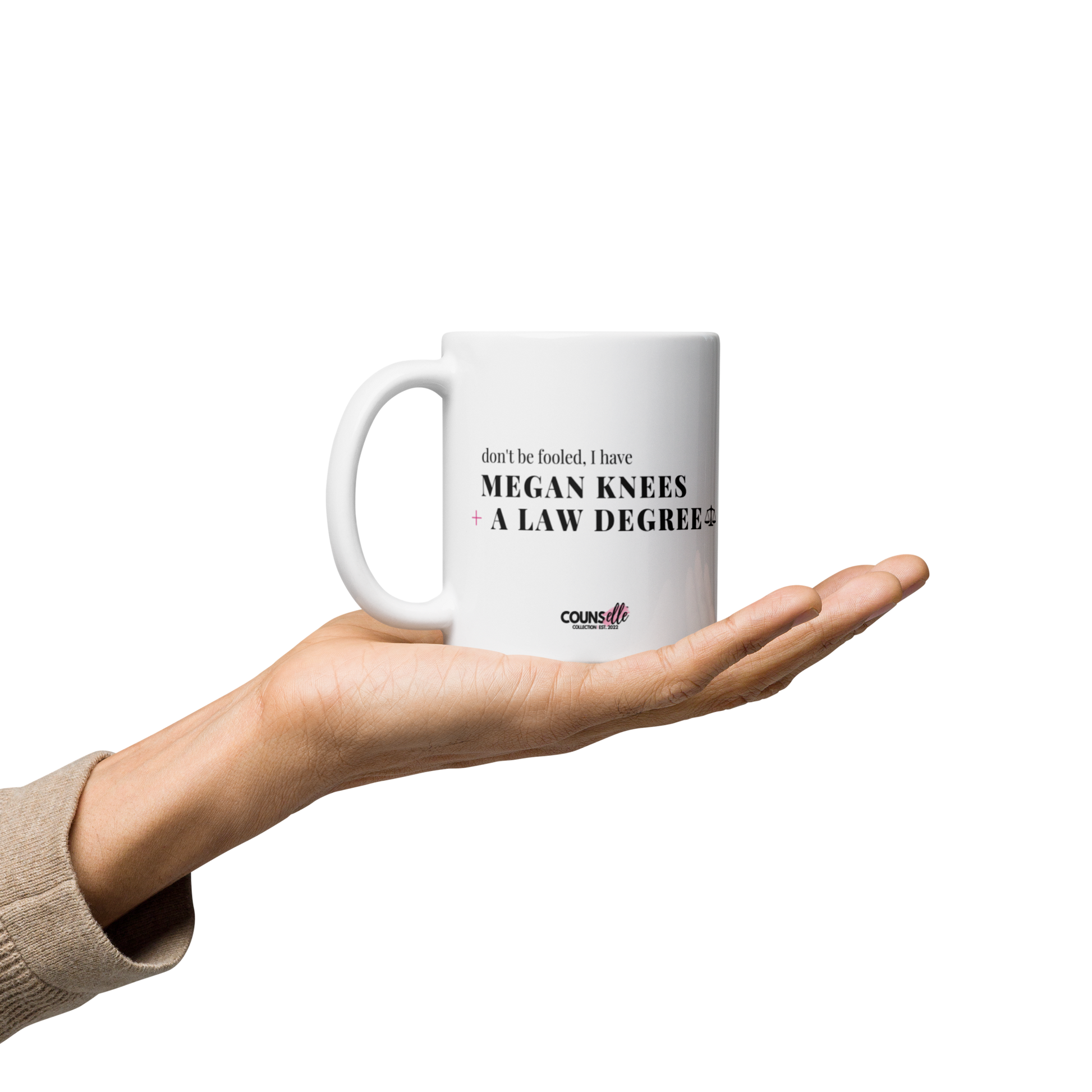 A ceramic mug featuring the bold and funny text: "DON'T BE FOOLED, I'VE GOT MEGAN KNEES AND A LAW DEGREE."
