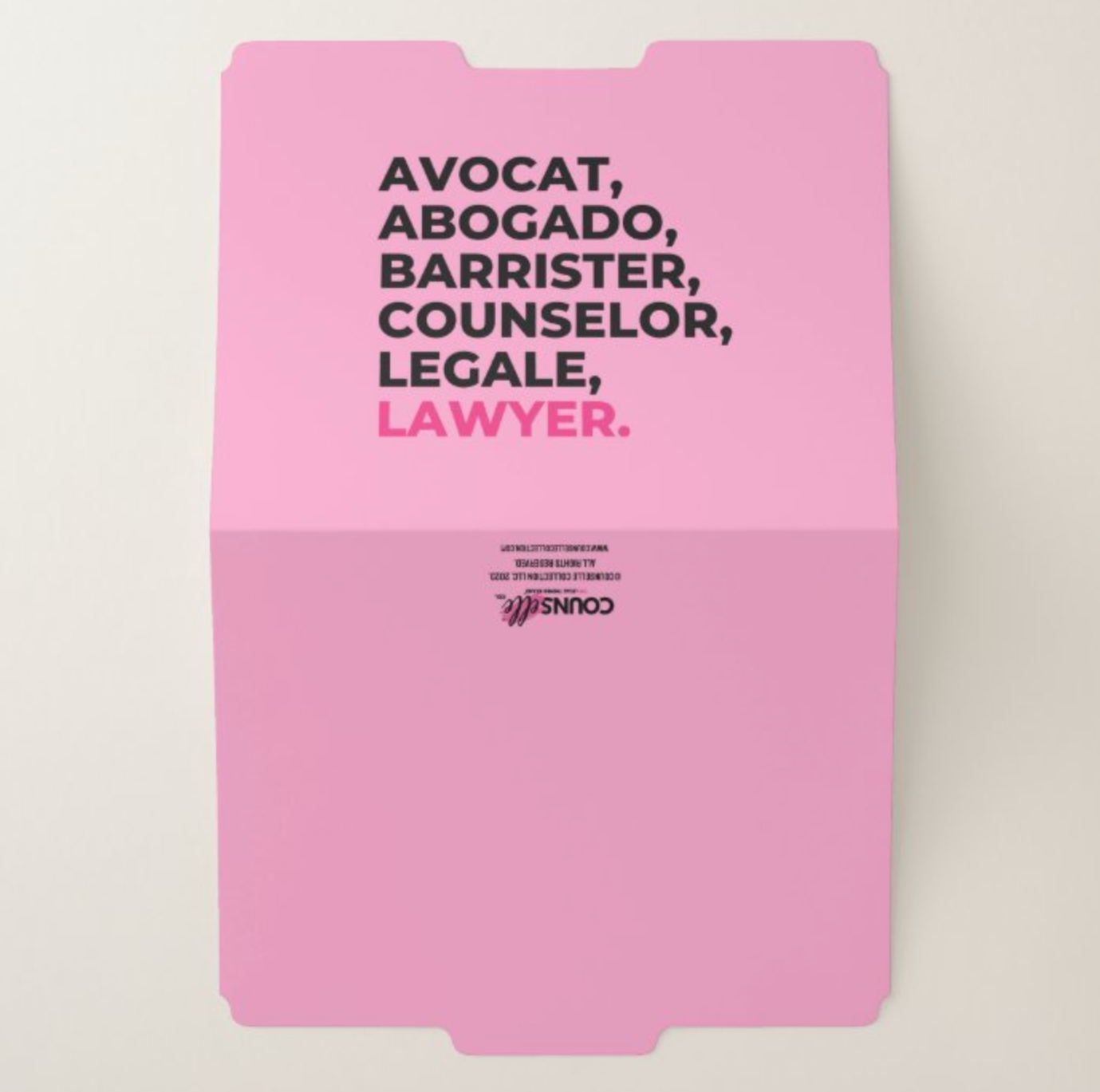 A pink file folder with tabs that showcases the word "LAWYER" translated into multiple languages in bold block font on the cover and the counselle collection logo at the back.