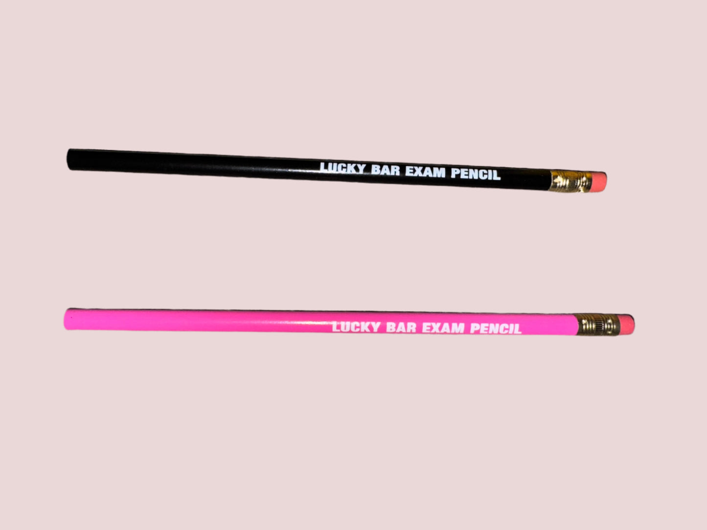 A black and a pink pencil with the words "LUCKY BAR EXAM PENCIL" written in uppercase white font