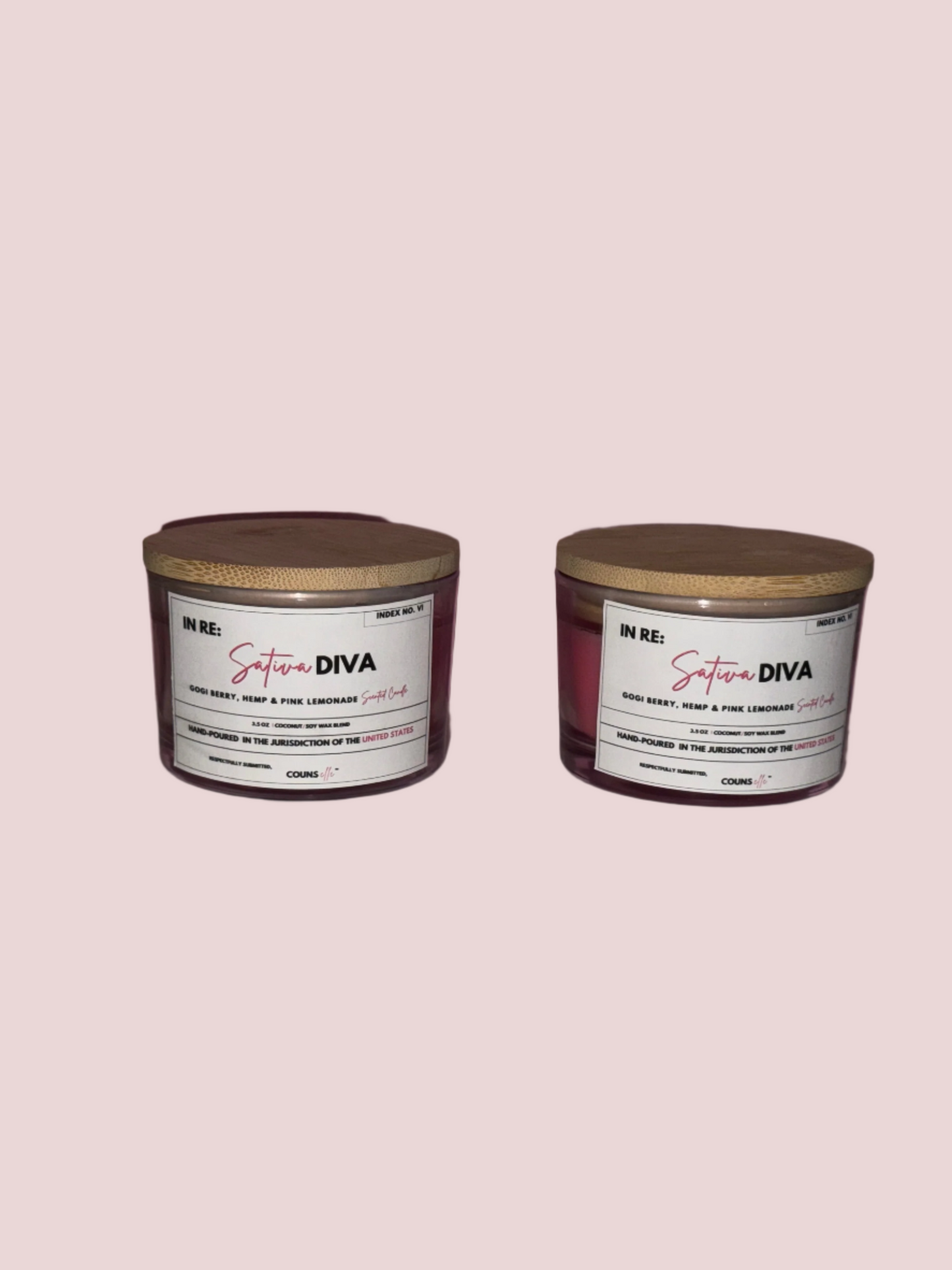 Two candles in a glass containers with lids, with white labels featuring the text "INDEX NO. VI", "IN RE:", "SATIVA DIVA", "GOGI BERRY, HEMP & PINK LEMONADE SCENTED CANDLE", "3.5 oz", "COCONUT/SOY WAX BLEND", "HAND-POURED IN THE JURISDICTION OF THE UNITED STATES", "RESPECTFULLY SUBMITTED", with the counsellecollection logo at the bottom of the design