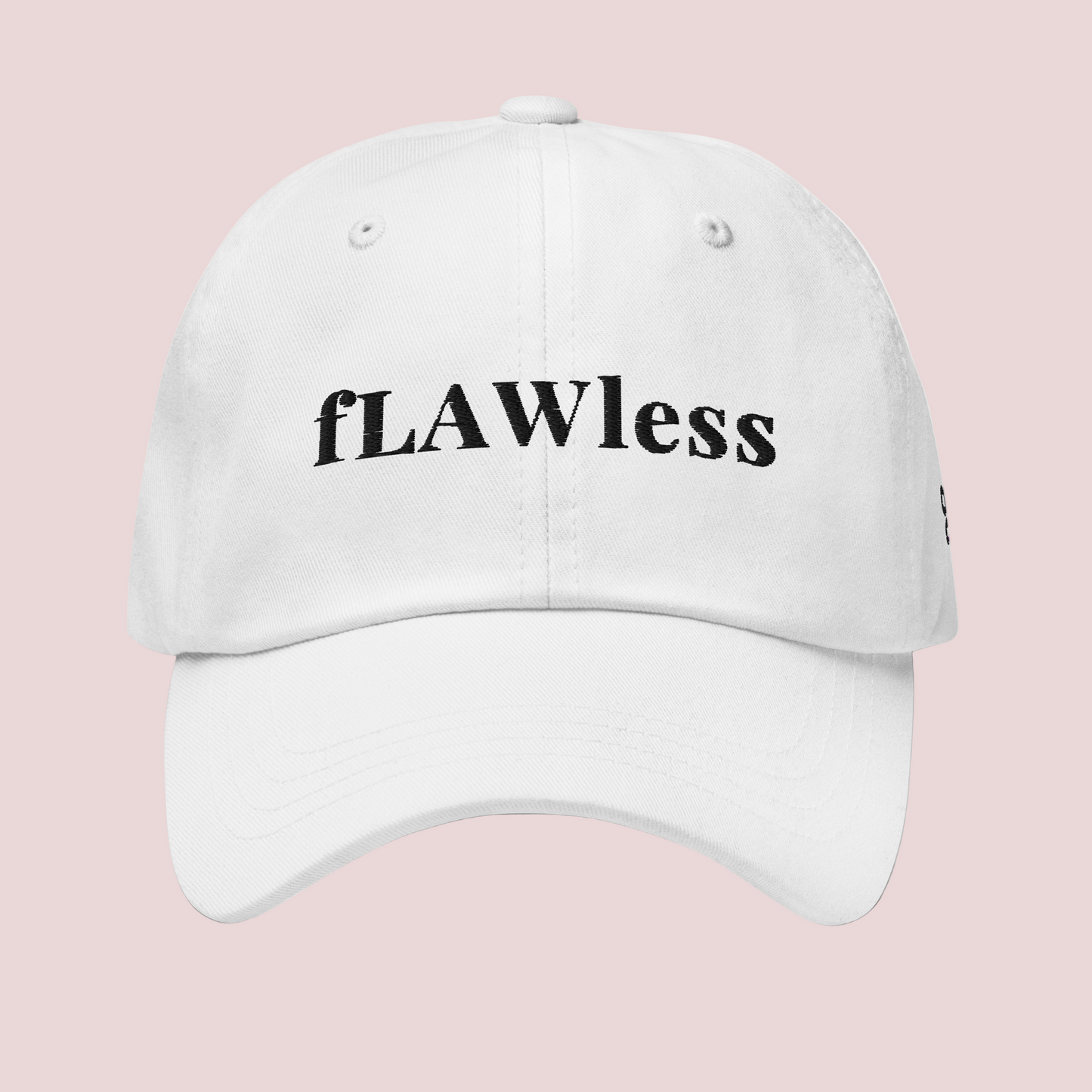 A white cap featuring the word "fLAWless" in black font