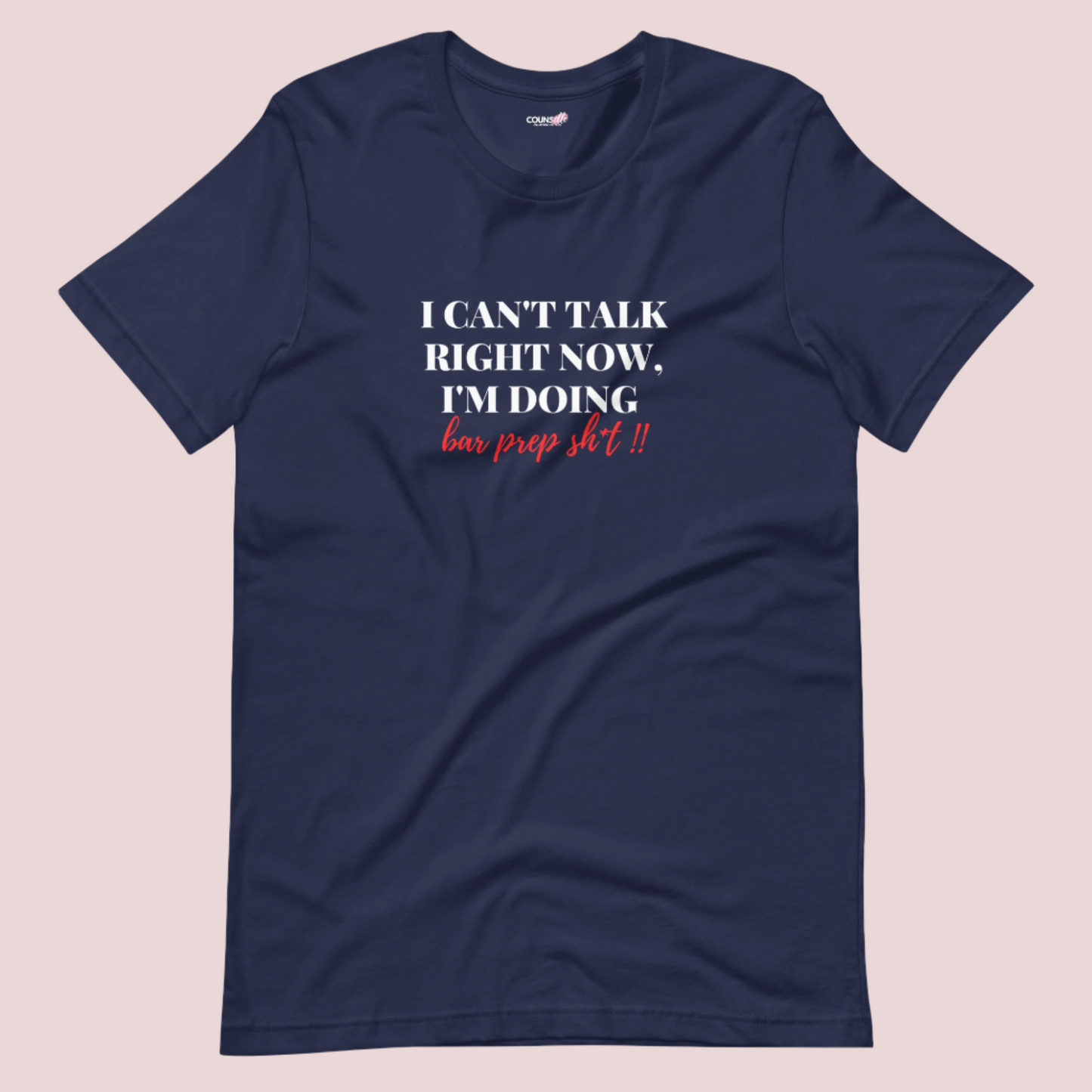 A navy blue roundneck tee showing the text "I CAN'T TALK RIGHT NOW, I'M DOING BAR PREP SH*T!"