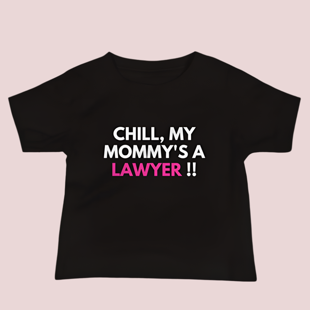 A black roundneck kid's tee featuring the quote "Chill my mommy's a lawyer" in uppercase text.