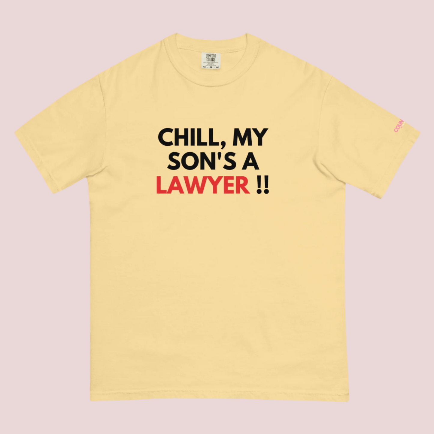 A yellow roundneck t-shirt with the slogan "CHILL MY SON'S A LAWYER." and the counsellecollection logo on the left sleeve.
