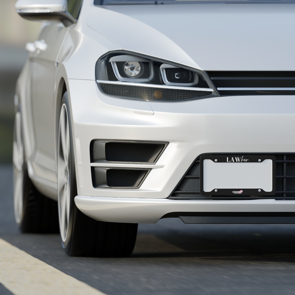 A white car showing a black license plate frame with the text "LAWher" at the top part and the counsellecollection logo at the bottom of the design.
