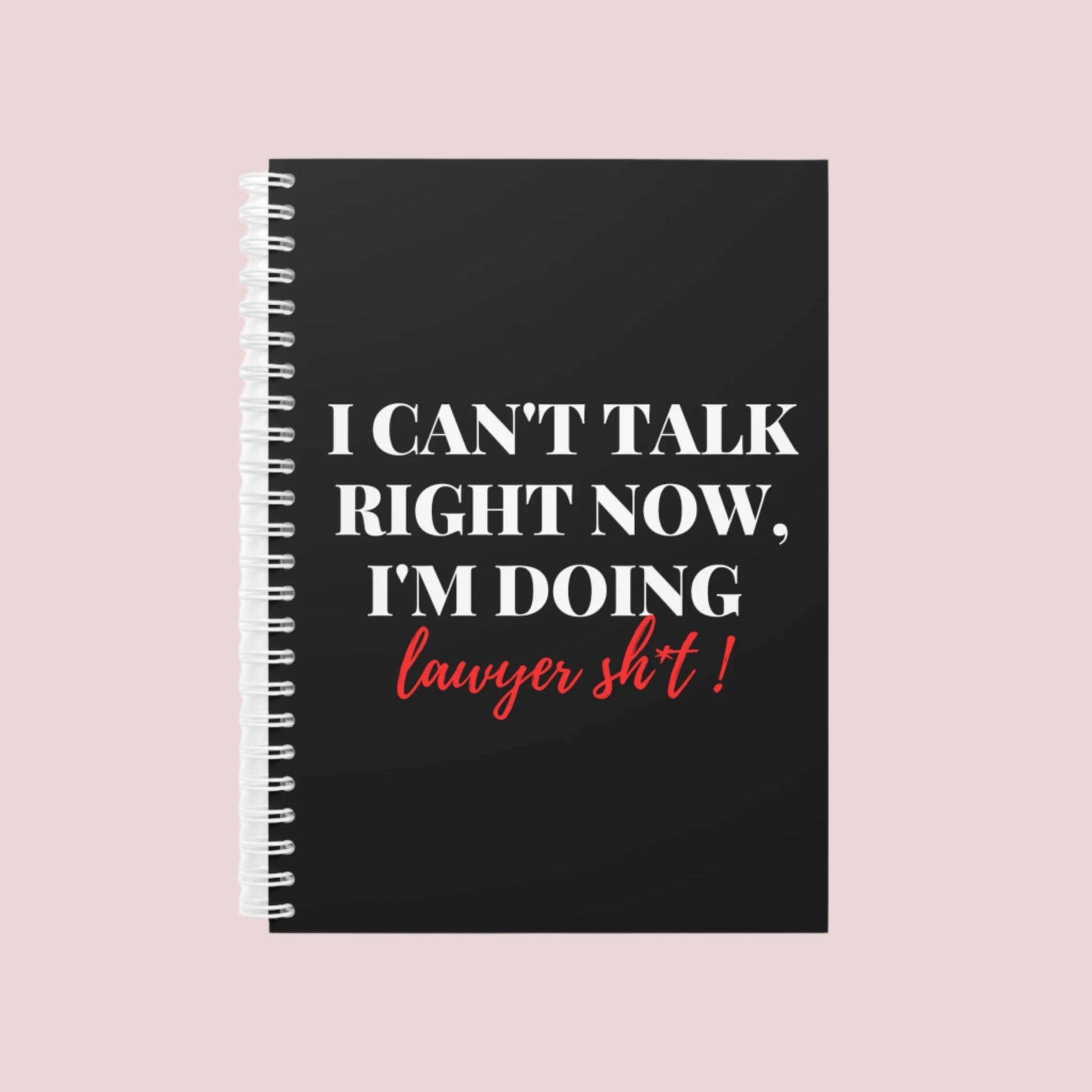 Notebook with the phrase "I can’t talk right now, I’m doing Lawyer girl sh*t" on the cover. Ring-bound with ruled pages for easy note-taking. Available in Black, Pinky, White, Grape, and Mellow Yellow, in both hardcover and softcover. Comes in two sizes: Small (5.5 x 8.5) and Large (8.5 x 11).