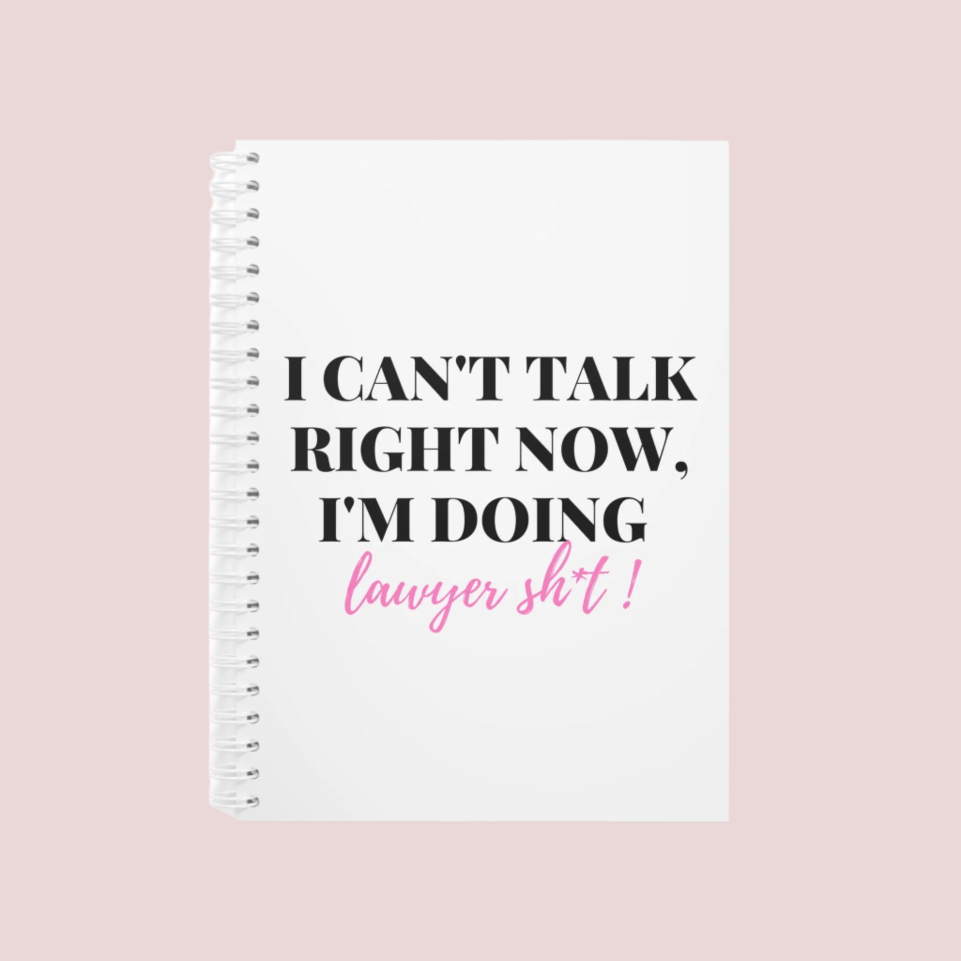 Notebook with the phrase "I can’t talk right now, I’m doing Lawyer girl sh*t" on the cover. Ring-bound with ruled pages for easy note-taking. Available in Black, Pinky, White, Grape, and Mellow Yellow, in both hardcover and softcover. Comes in two sizes: Small (5.5 x 8.5) and Large (8.5 x 11).