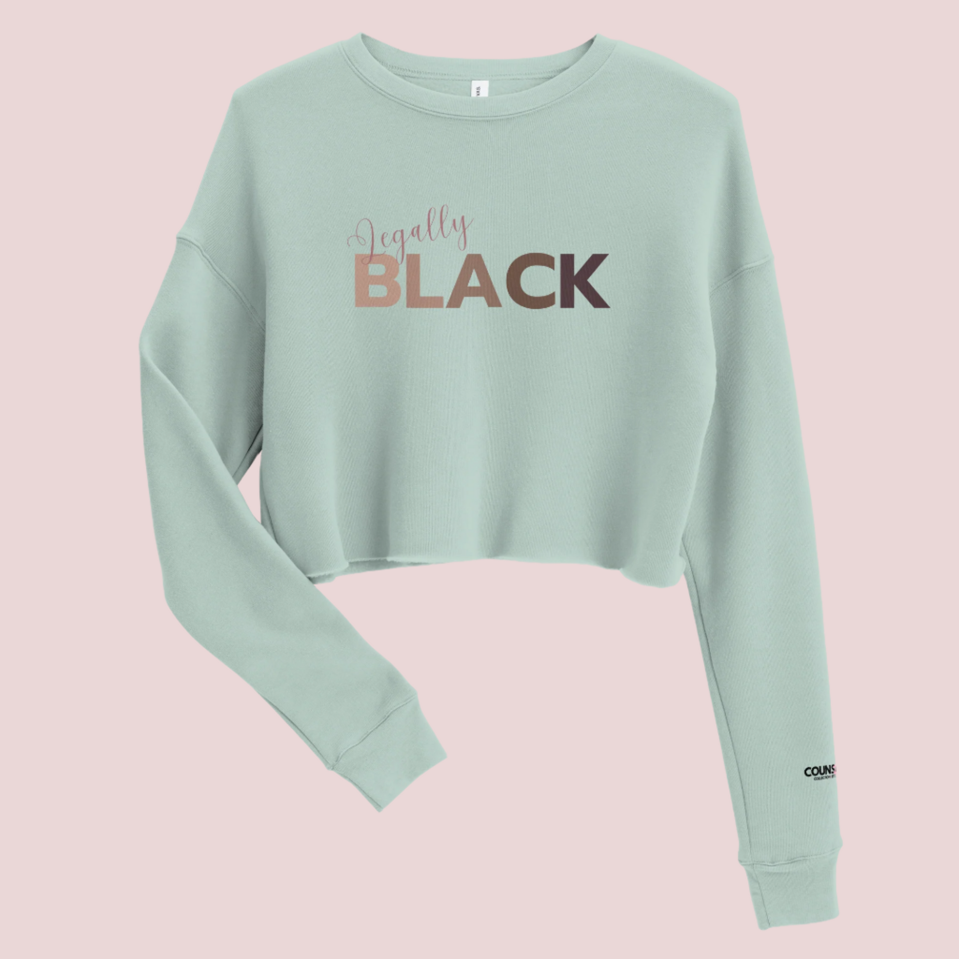  A mint, roundneck, long-sleeved tee, with the text "Legally", in script, and "BLACK" in uppercase font. The counsellecollection logo is seen on the left sleeve.