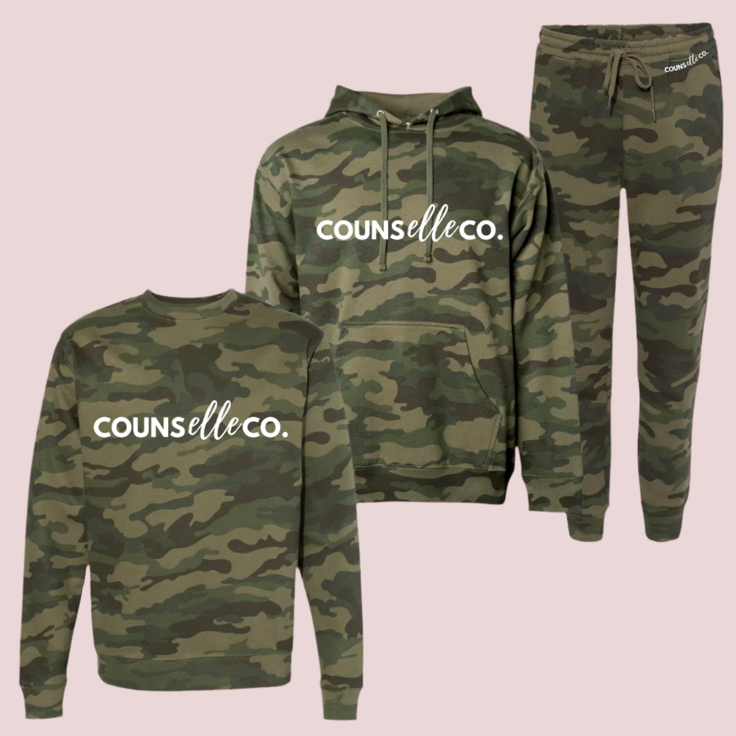A camo patterned three-piece set of a long-sleeved shirt, hoodie, and sweatpants showing the text "counselleco" in white font.
