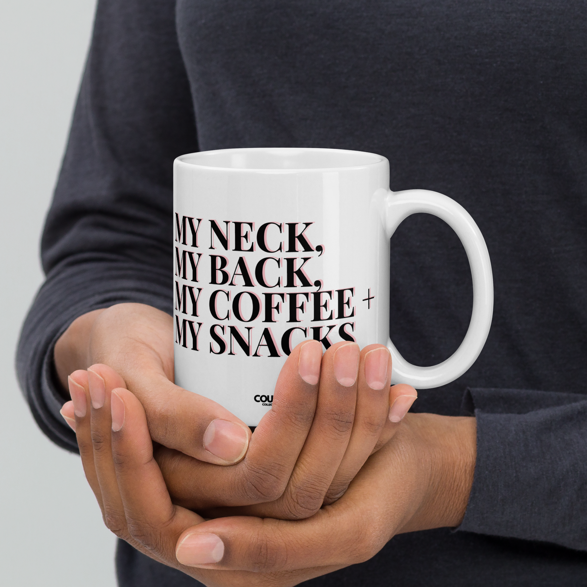 A white ceramic mug featuring eye-catching bold block text: "MY NECK, MY BACK, MY COFFEE, MY SNACKS."