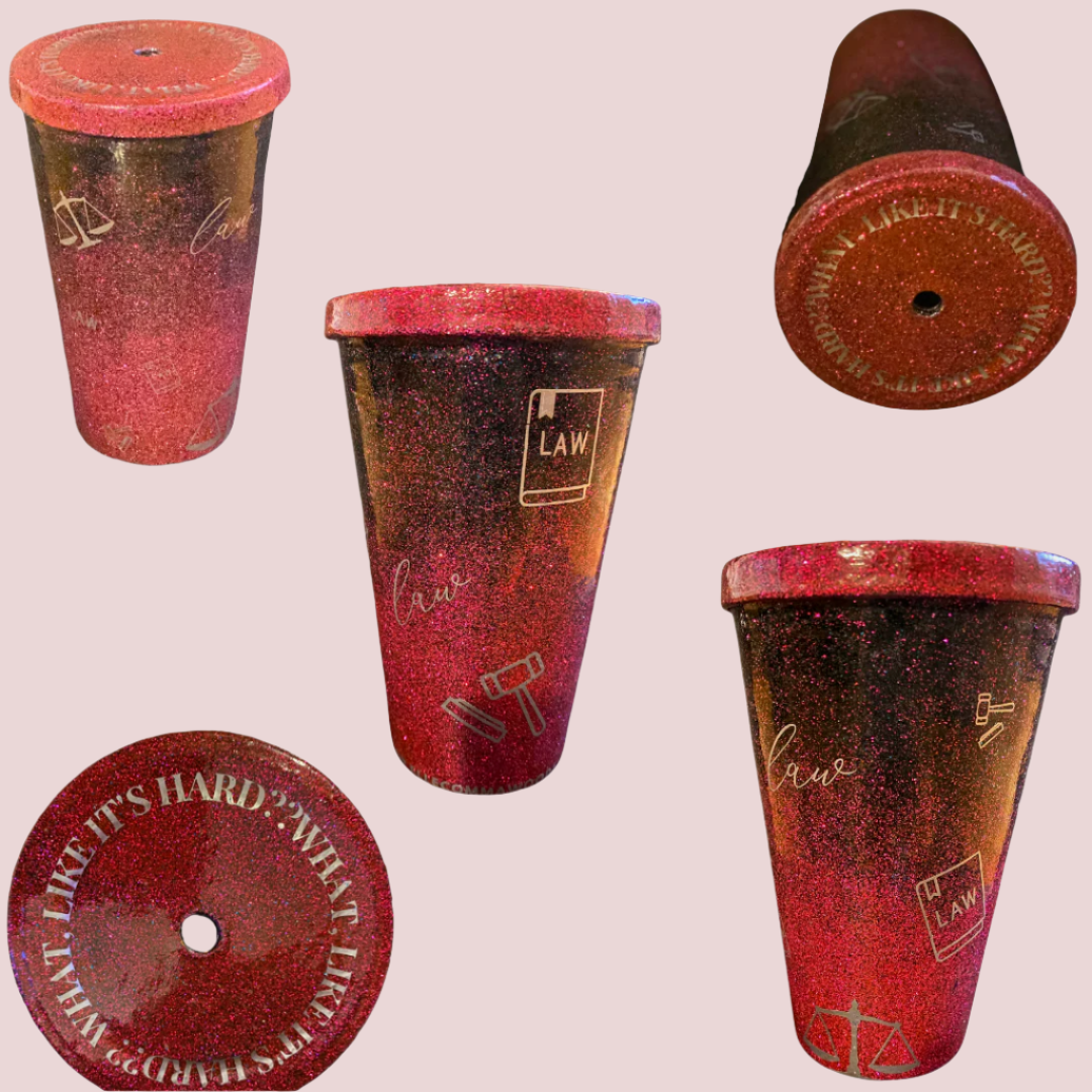 Different angles of a glittery tumbler, with a lid featuring the text "WHAT, LIKE IT'S HARD?" in block uppercase letters, and illustrations / icons on the sides of the tumbler such as justice scales, a law book, a gavel, and the word "law" in script font.