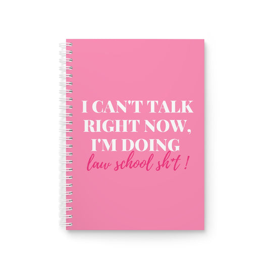 A pink wire bound notebook with the text "I can't talk right now, I'm doing law school sh*t". Sold by the CounSELLE Collection.